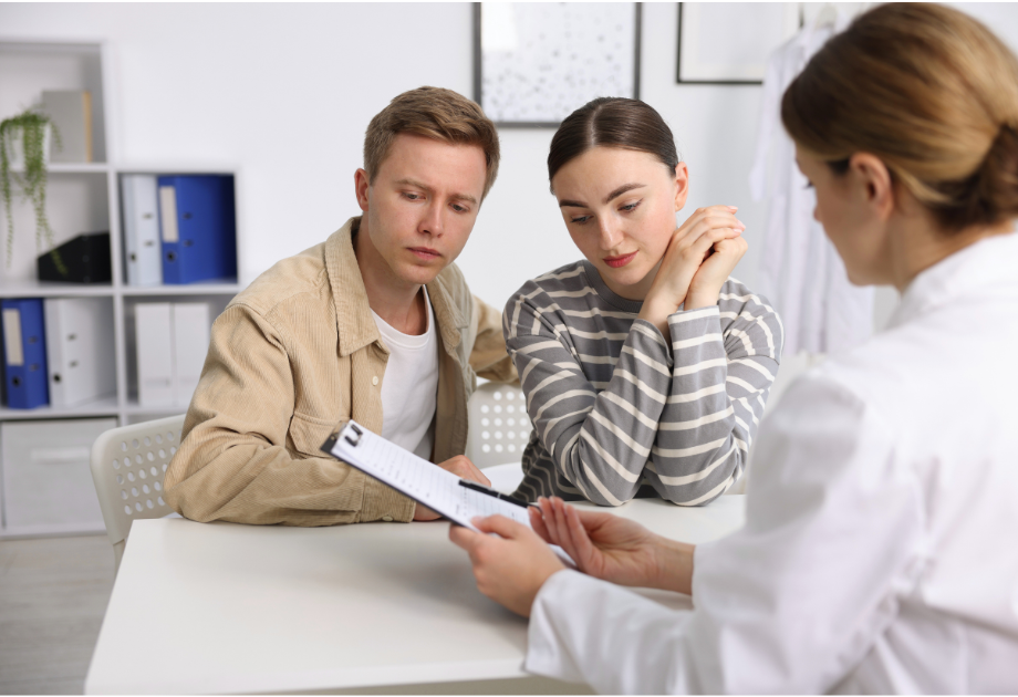 a couple going over results with a doctor 